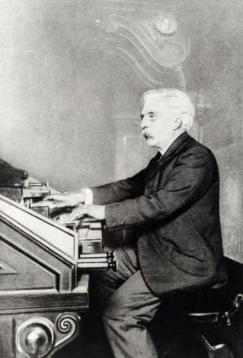 Composer Gabriel Fauré playing the organ