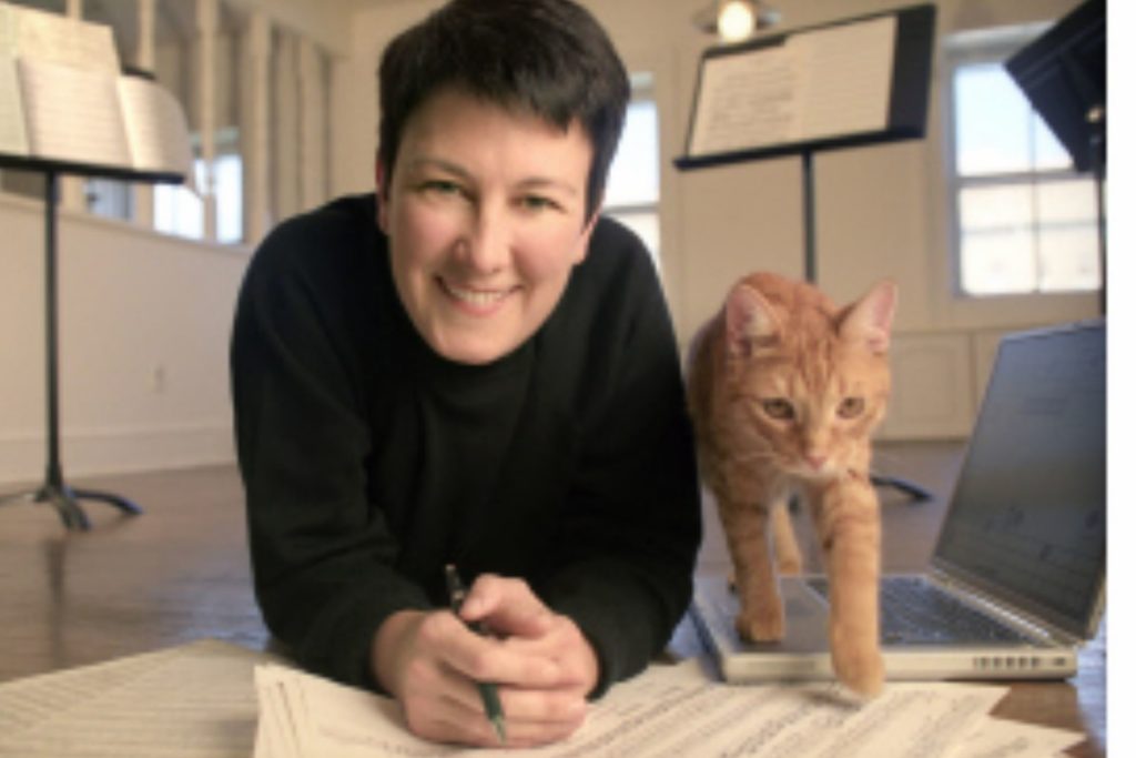 Composer Jennifer Higdon with an orange cat next to her