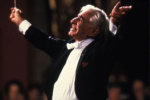 Photograph of Leonard Bernstein conducting an orchestra