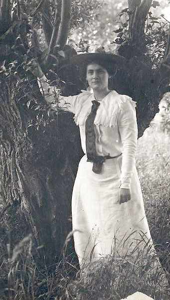Photograph of  "Lily" Marie-Rosalie Texier posed by a tree