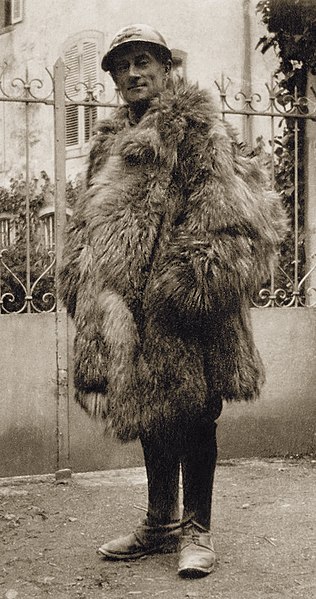 Photograph of Maurice Ravel dressed in a fur and his soldier uniform on in WWI