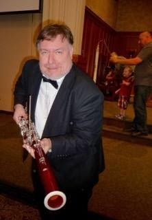 Steven A. Kennedy, BA, MA, ABD, with a bassoon