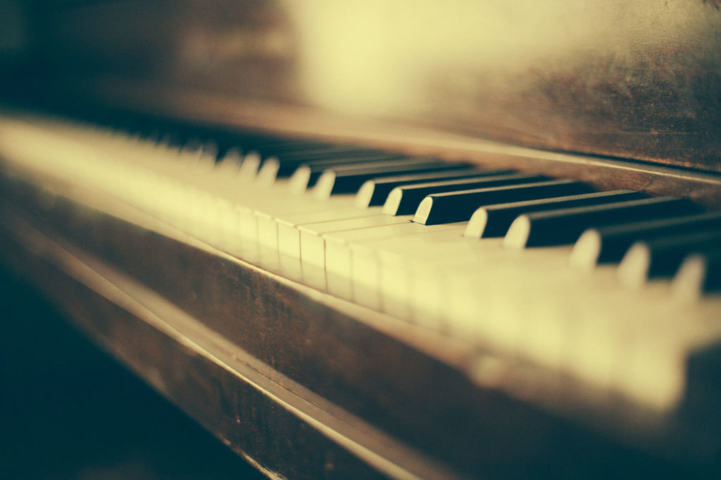Vintage looking photo showing a close up of piano keys